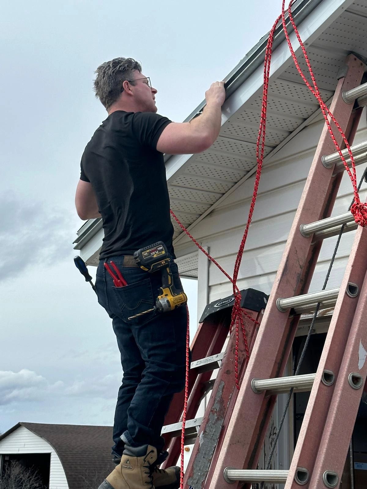 On-site work at the roofline of a residential building